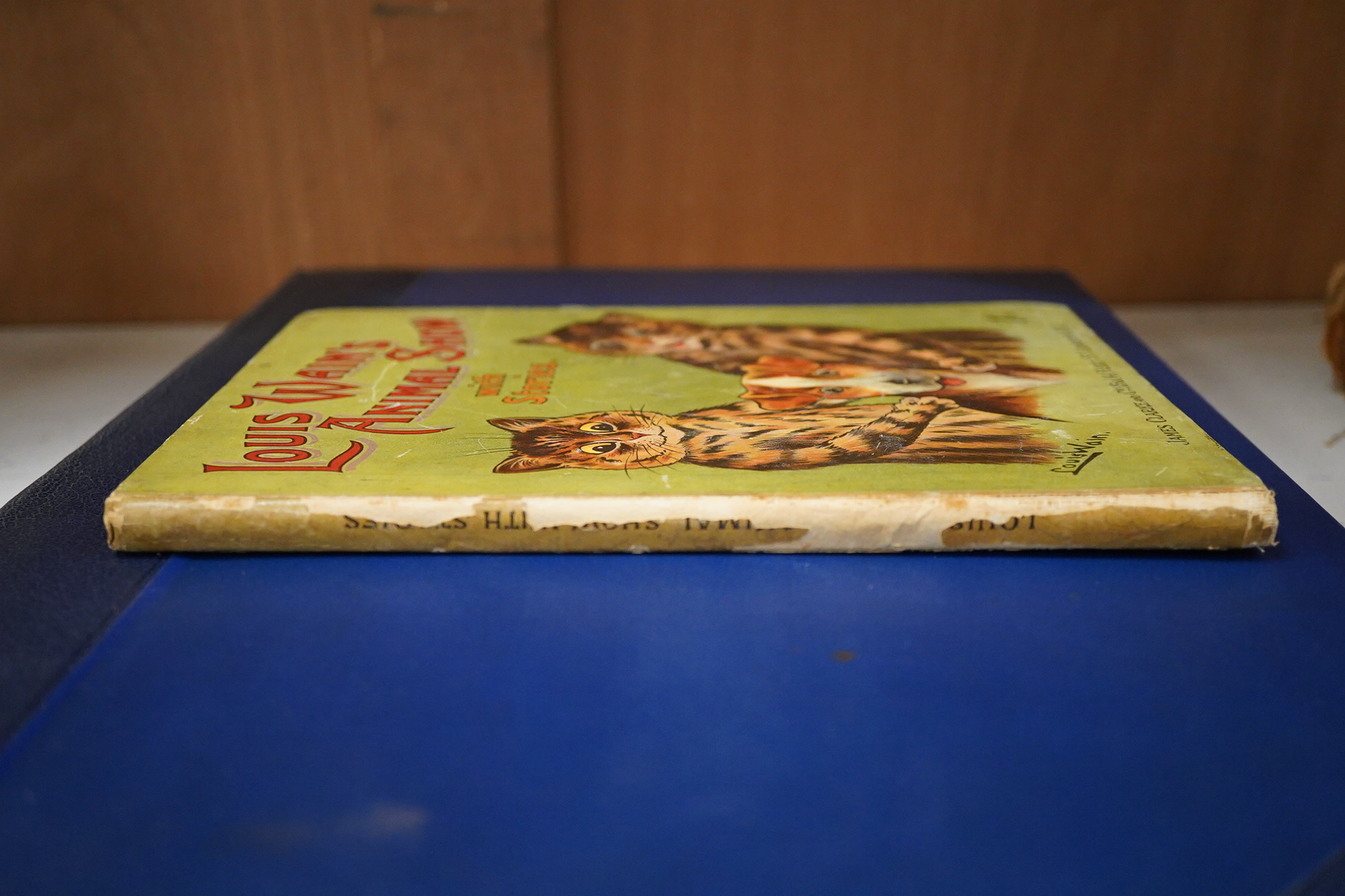Wain, Louis - Louis Wain's Animal Show, with Stories in Prose and Verse. 1st edition, 4to, original pictorial boards, numerous black and white illustrations by Louis Wain, contemporary ink presentation inscriptions to fr